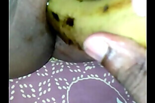 Tamil girl play with banana
